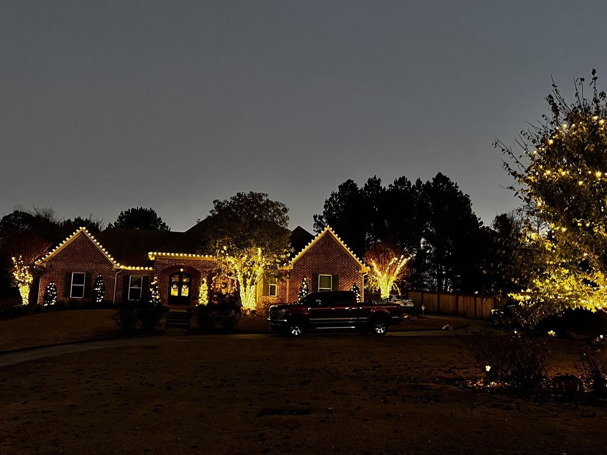 Superscapes Christmas roofline lighting at dusk