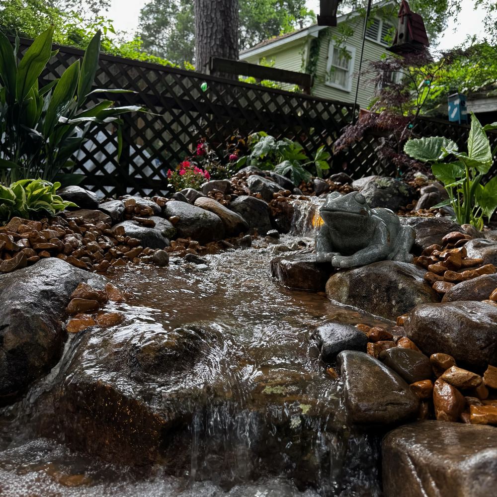A Superscapes pondless rock stream tumbling over natural stone